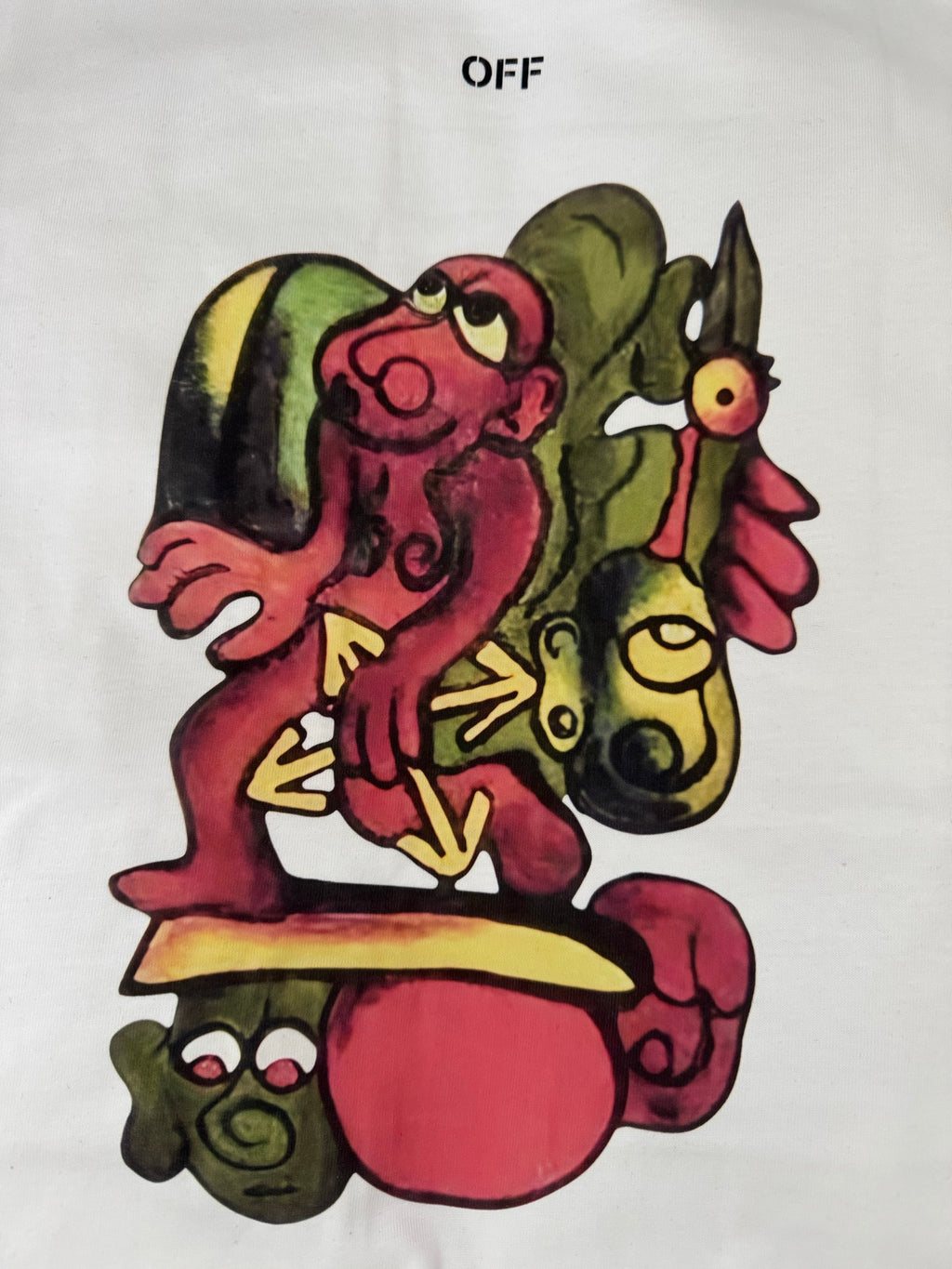Off-white T-shirt featuring colorful character face graphic
