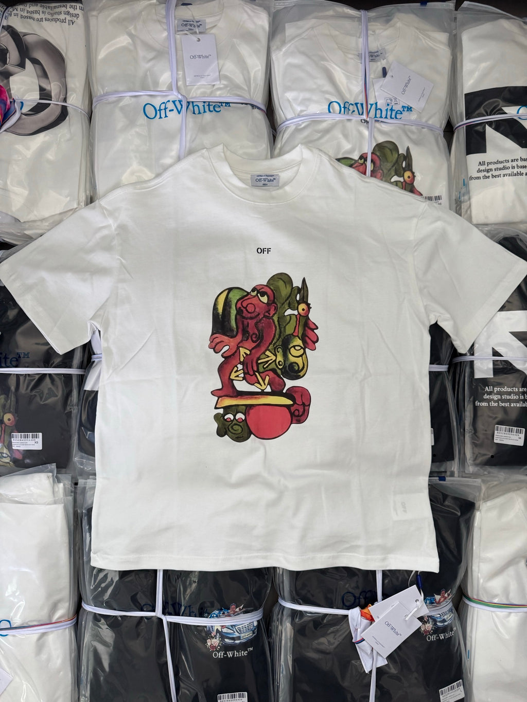 Off-white T-shirt with small OFF text and colorful character graphic