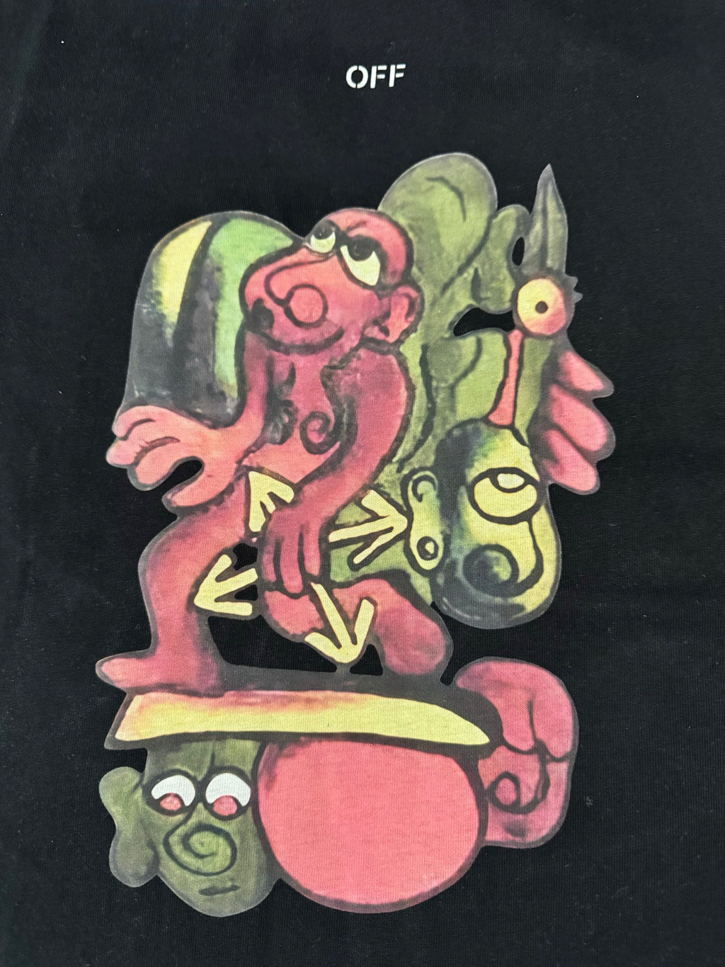 Black T-shirt with colorful cartoon characters graphic, close-up