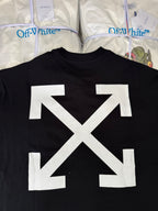 Black T-shirt back with oversized white arrow X graphic, close-up