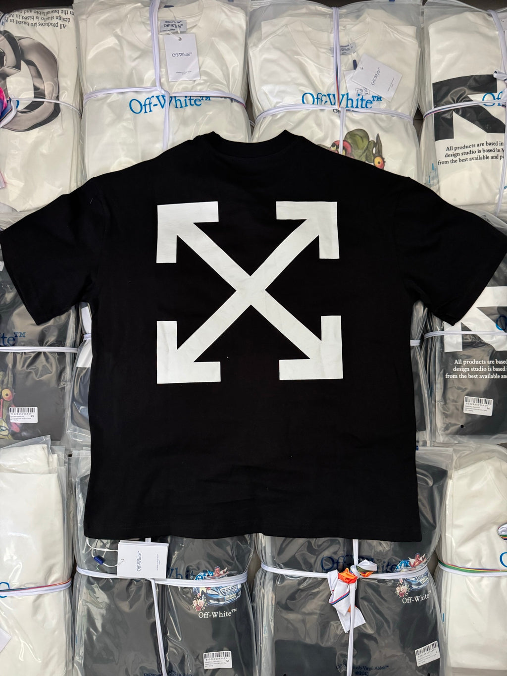 Black T-shirt back with large white arrow X graphic