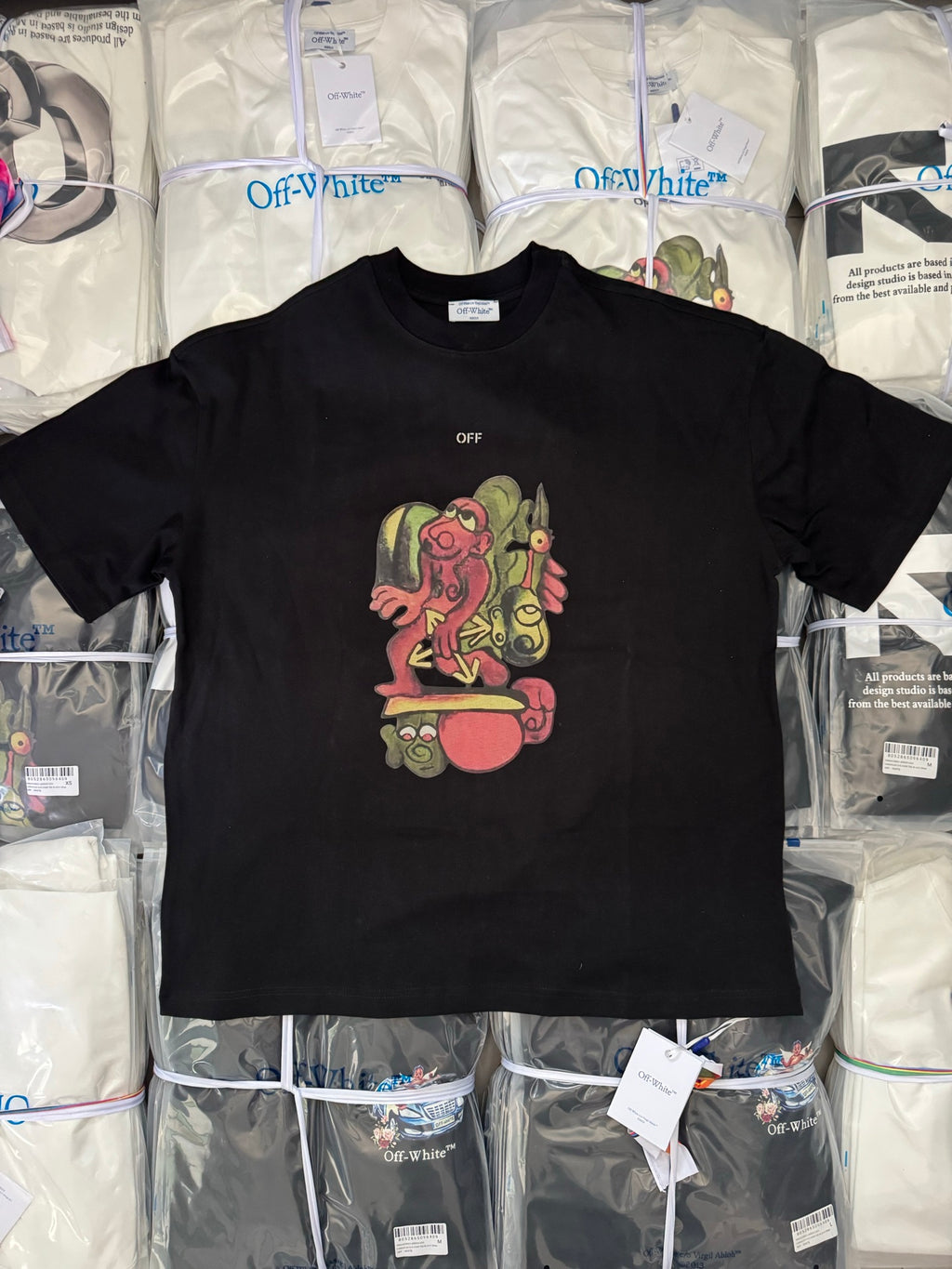 Black T-shirt with colorful cartoon graphic and small OFF text