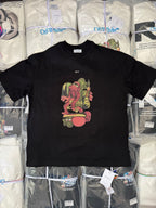 Black T-shirt with colorful cartoon graphic and small OFF text