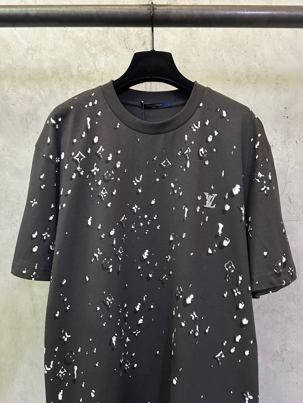 Black crewneck short-sleeve T-shirt with scattered white LV-style motif print