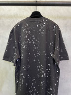 Black crewneck short-sleeve T-shirt with scattered white motif print, rear view