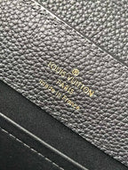 Louis Vuitton Paris France label on textured navy leather lining