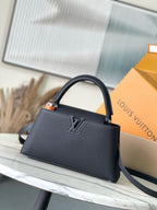 Navy leather top-handle bag with shoulder strap and LV emblem on front