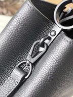 Close-up of navy leather bag clasp and metal ring hardware