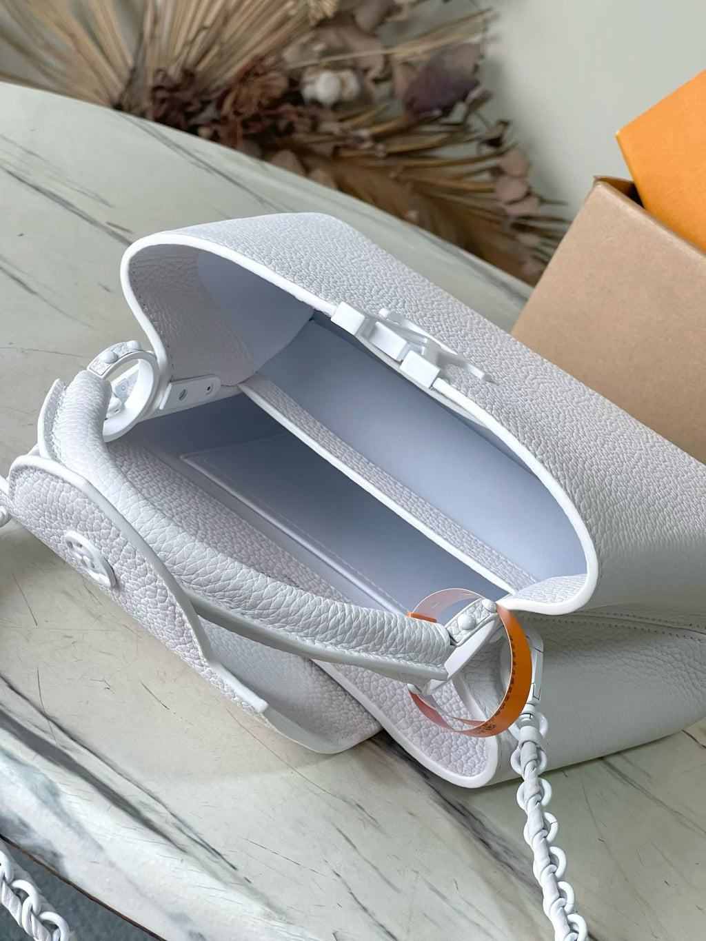 Louis Vuitton small leather handbag, white open top with lined interior and chain strap