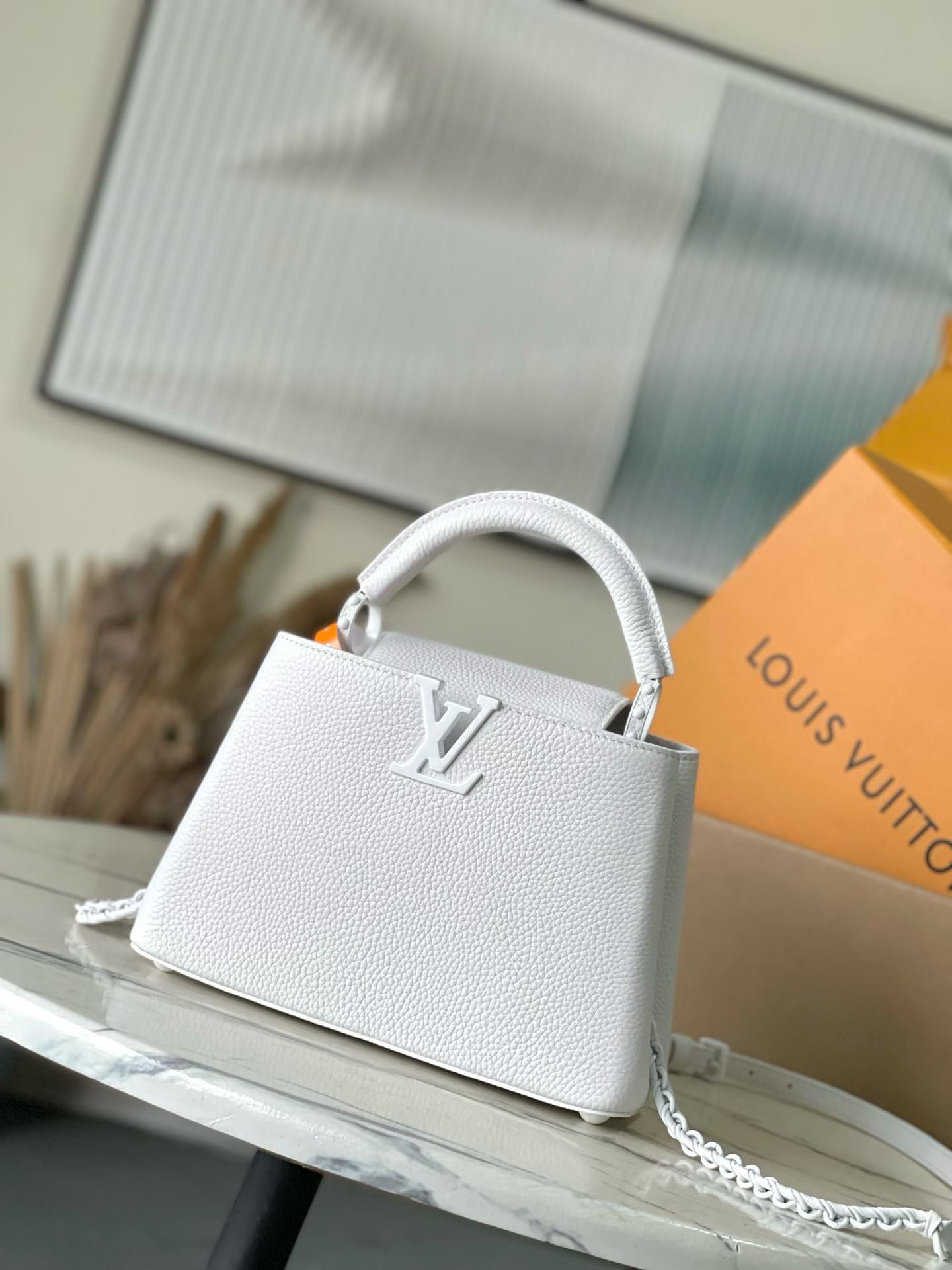 Louis Vuitton small leather handbag, white with LV front emblem and chain strap