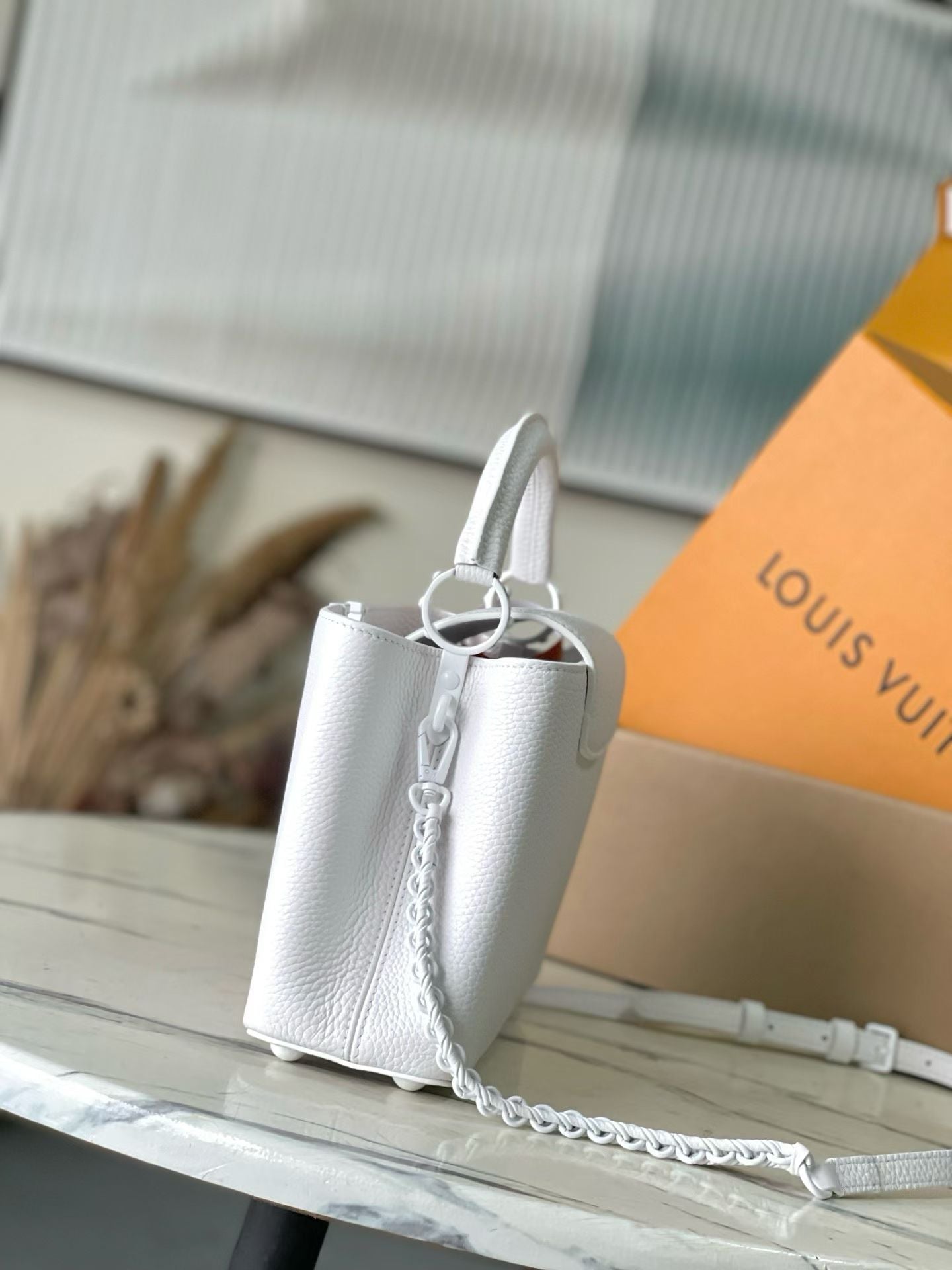 Louis Vuitton small leather handbag, white with top handle and shoulder chain strap
