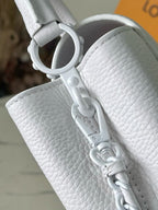White leather handbag with ring clasp and chain strap hardware