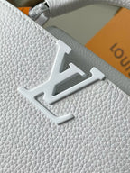 White textured leather handbag with engraved LV monogram emblem