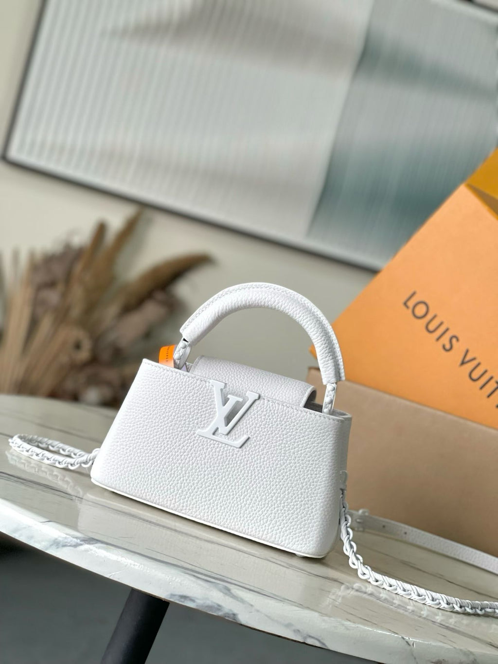 White mini handbag with top handle and chain strap, front logo detail