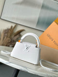 White mini handbag with top handle and chain strap, front logo detail