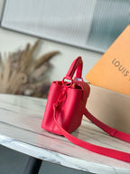 Red leather mini handbag with front flap and shoulder strap
