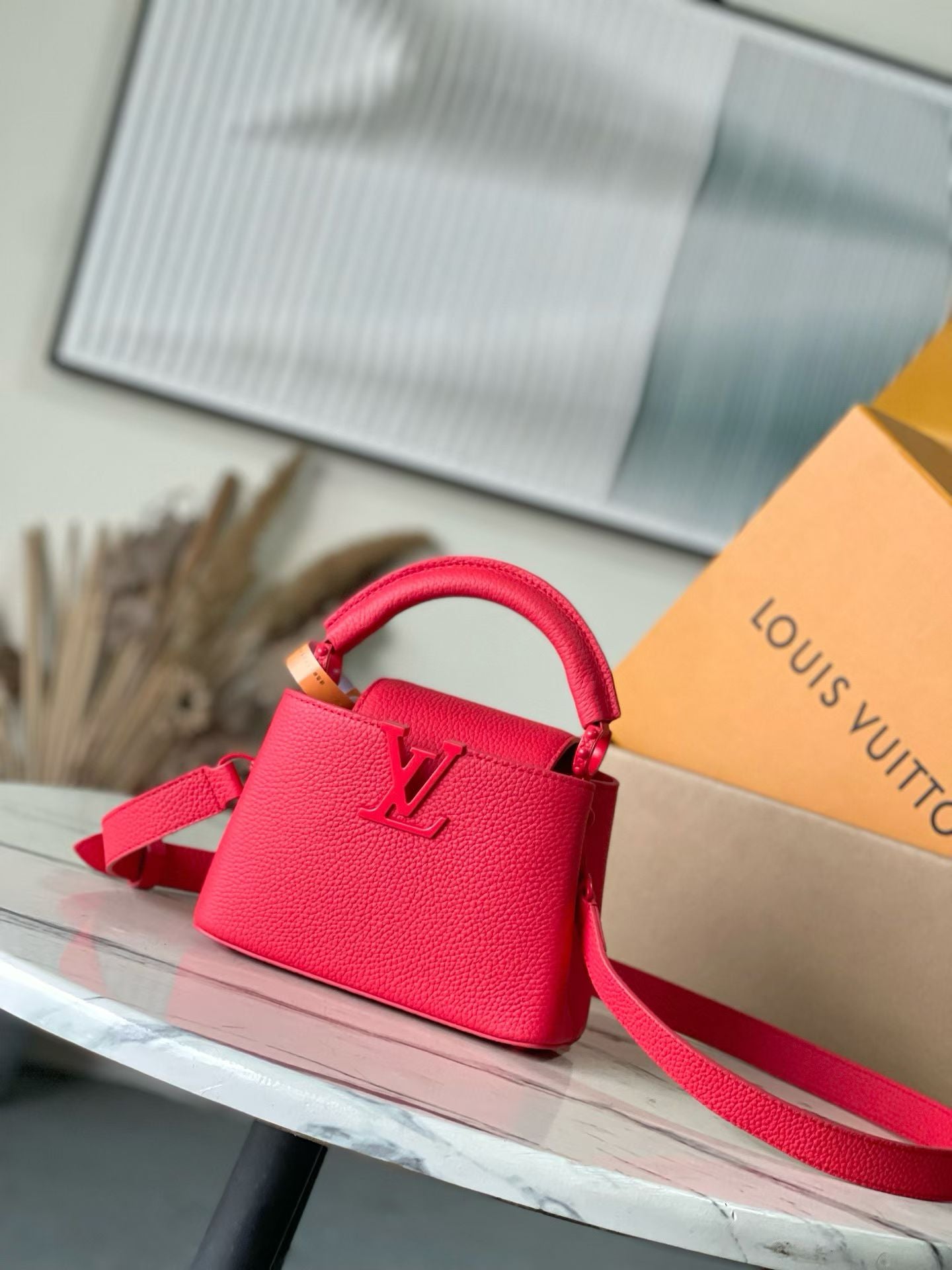 Louis Vuitton red leather mini handbag with top handle and shoulder strap