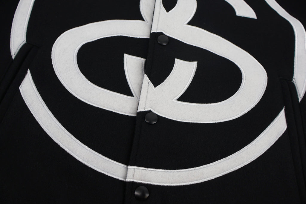 Black jacket front with oversized white double C emblem