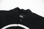 Black ribbed knit collar with snap placket and Stussy logo