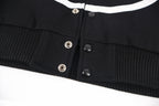Black jacket waistband with ribbed hem and snap button placket