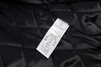 Black quilted lining with size and care label