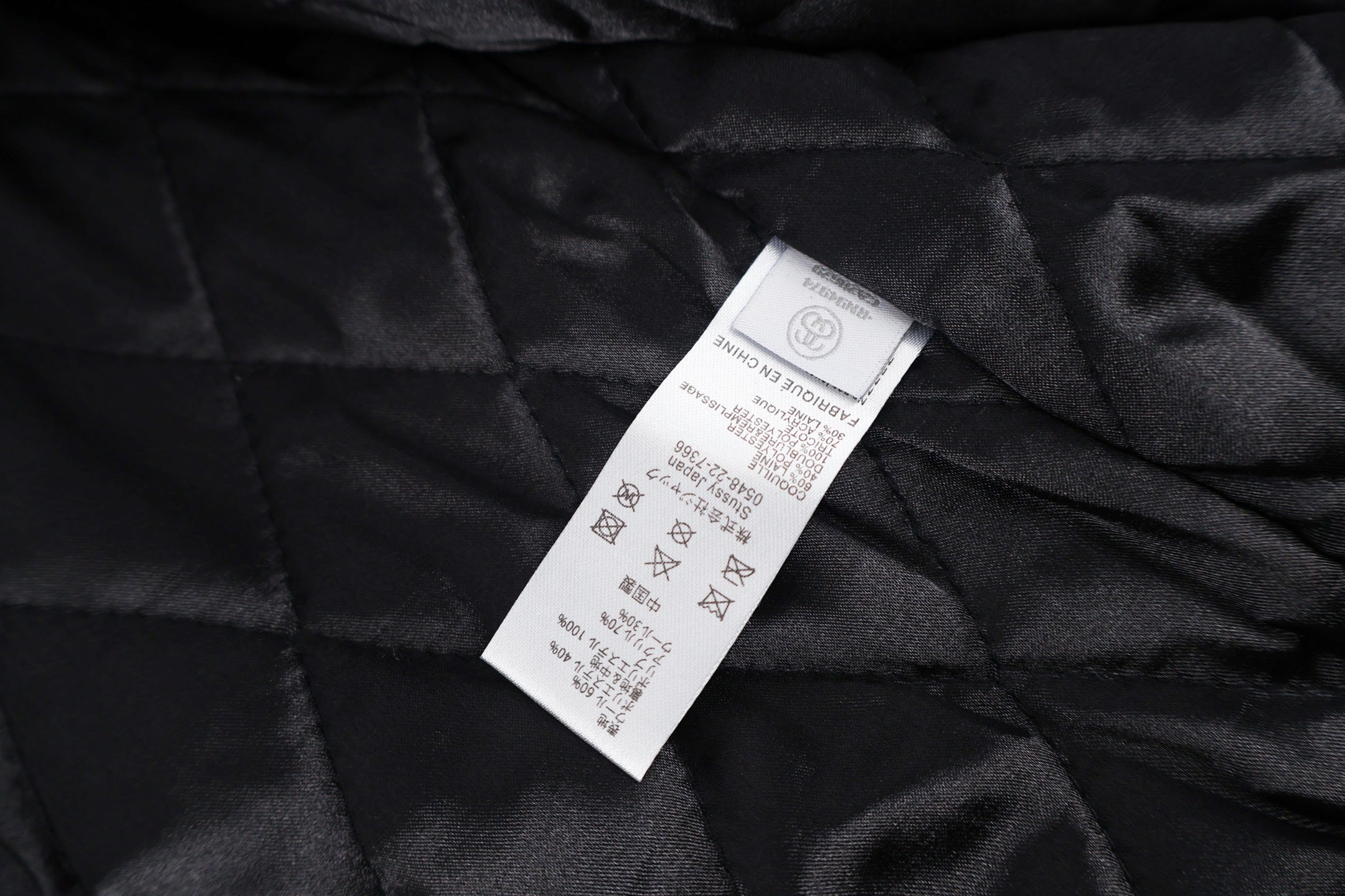 Black quilted lining with size and care label