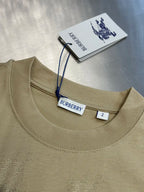 Beige crew-neck short-sleeve top with Burberry logo neck label
