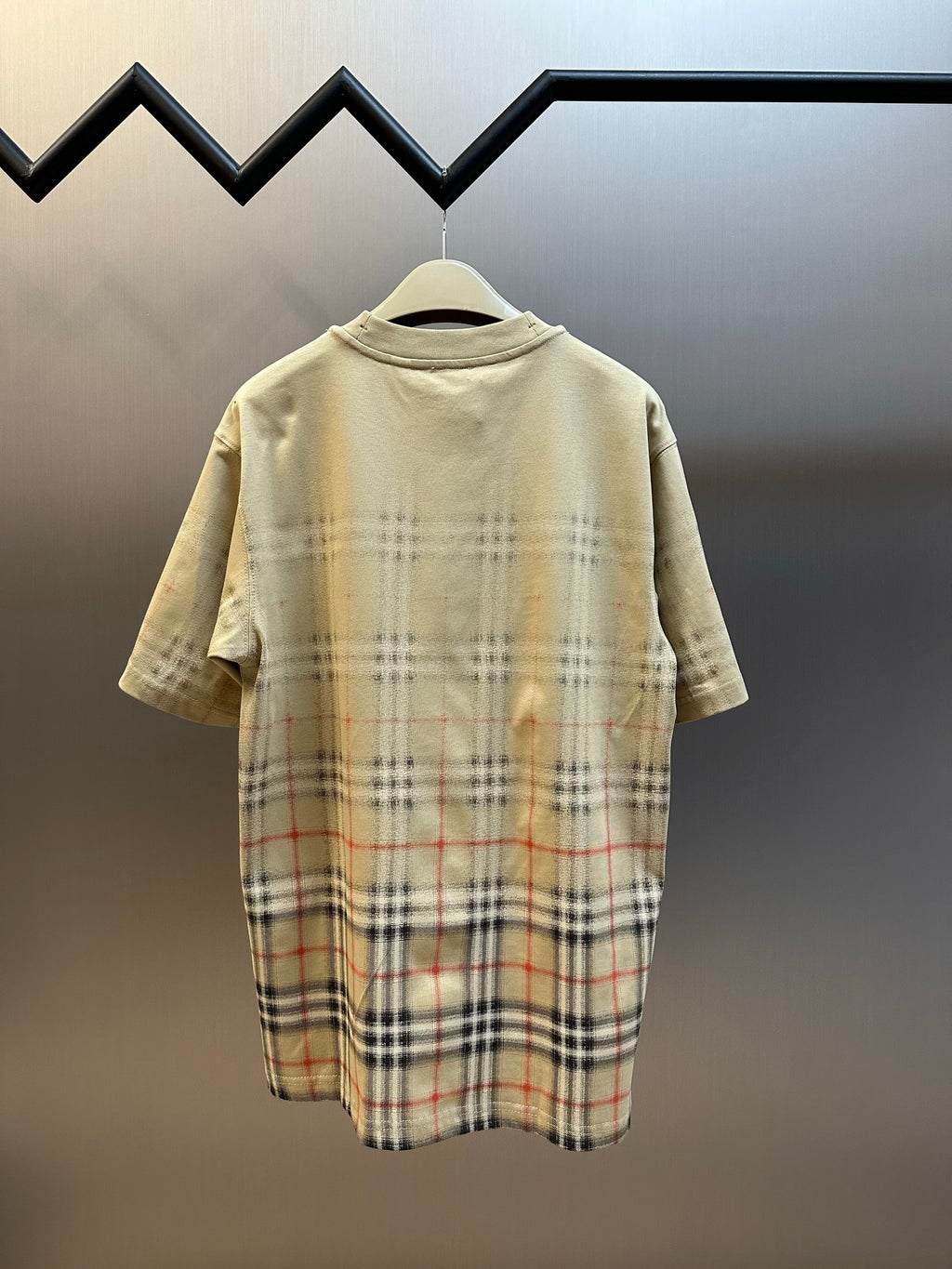 Beige short-sleeve shirt with crew neck and check plaid hem panel