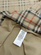 Beige shirt with check plaid cuff and interior care label