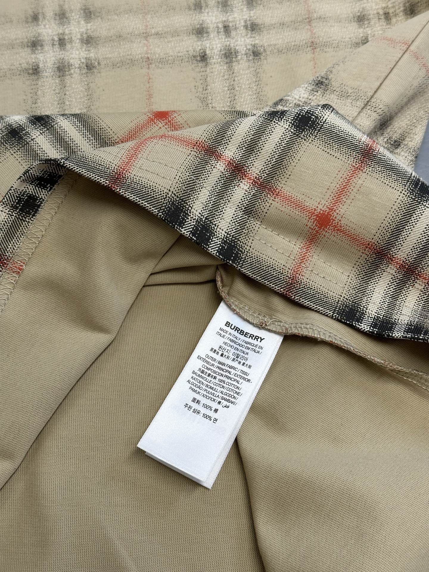 Beige shirt with check plaid cuff and interior care label