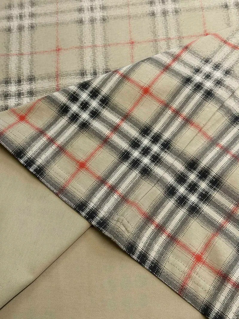 Plaid hem panel on beige short-sleeve top