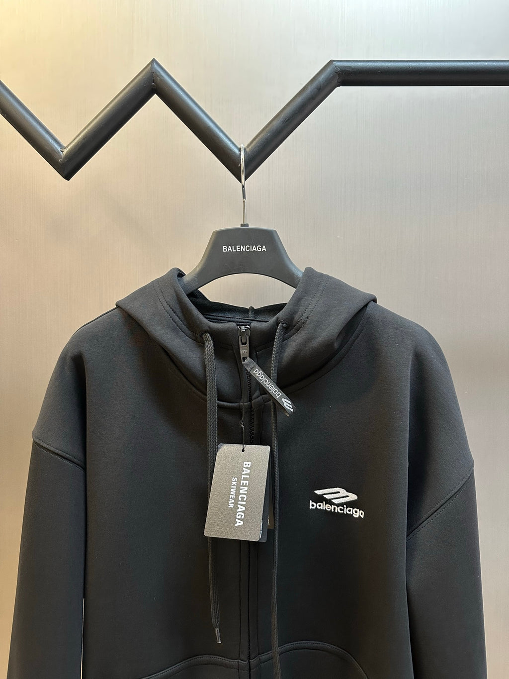 Black Balenciaga zip-up hoodie, hood with drawstring and chest logo