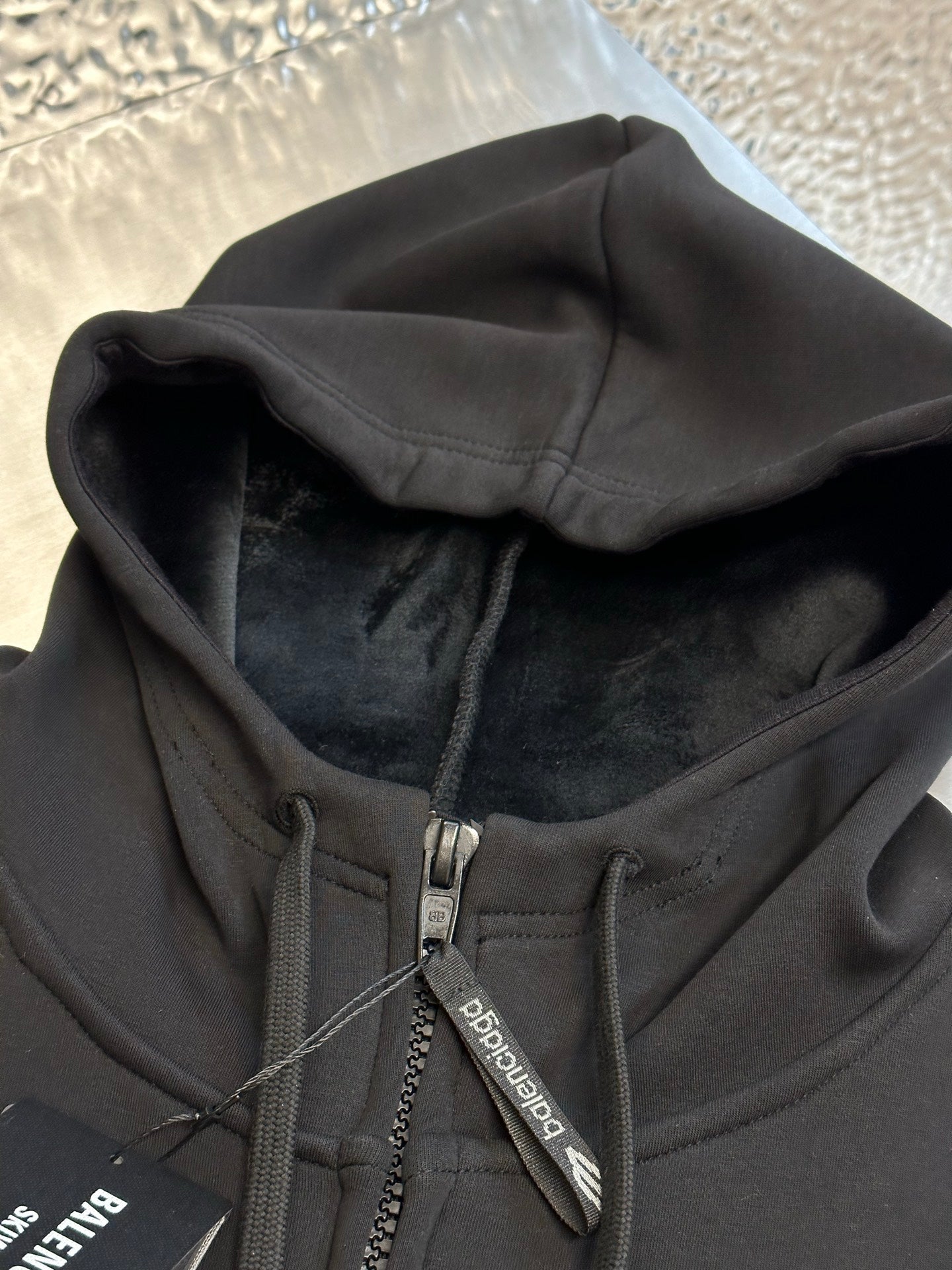 Black Balenciaga zip-up hoodie with hood lining and front zipper
