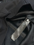 Black Balenciaga zip-up hoodie fabric with hanging brand label tag