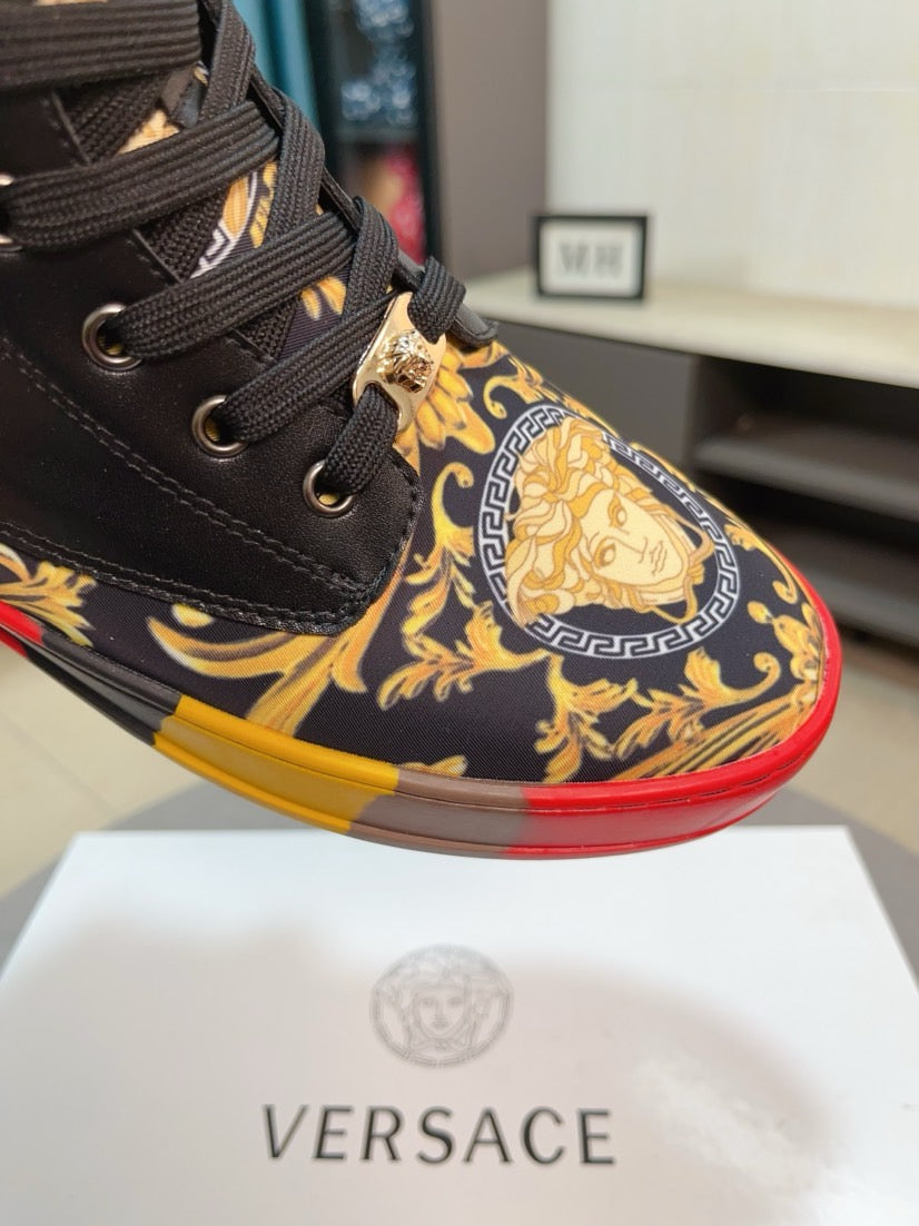 Versace high-top sneaker detail, black leather with gold medallion and patterned side panel