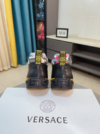 Versace high-top sneakers back view, black heels with patterned sock collars and chunky sole