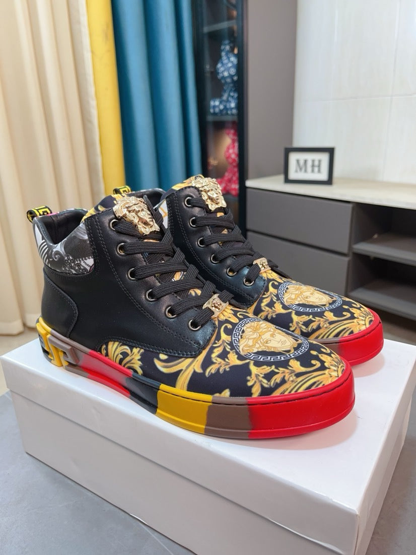 Versace high-top sneakers pair, black uppers with gold/blue baroque print and red/yellow soles