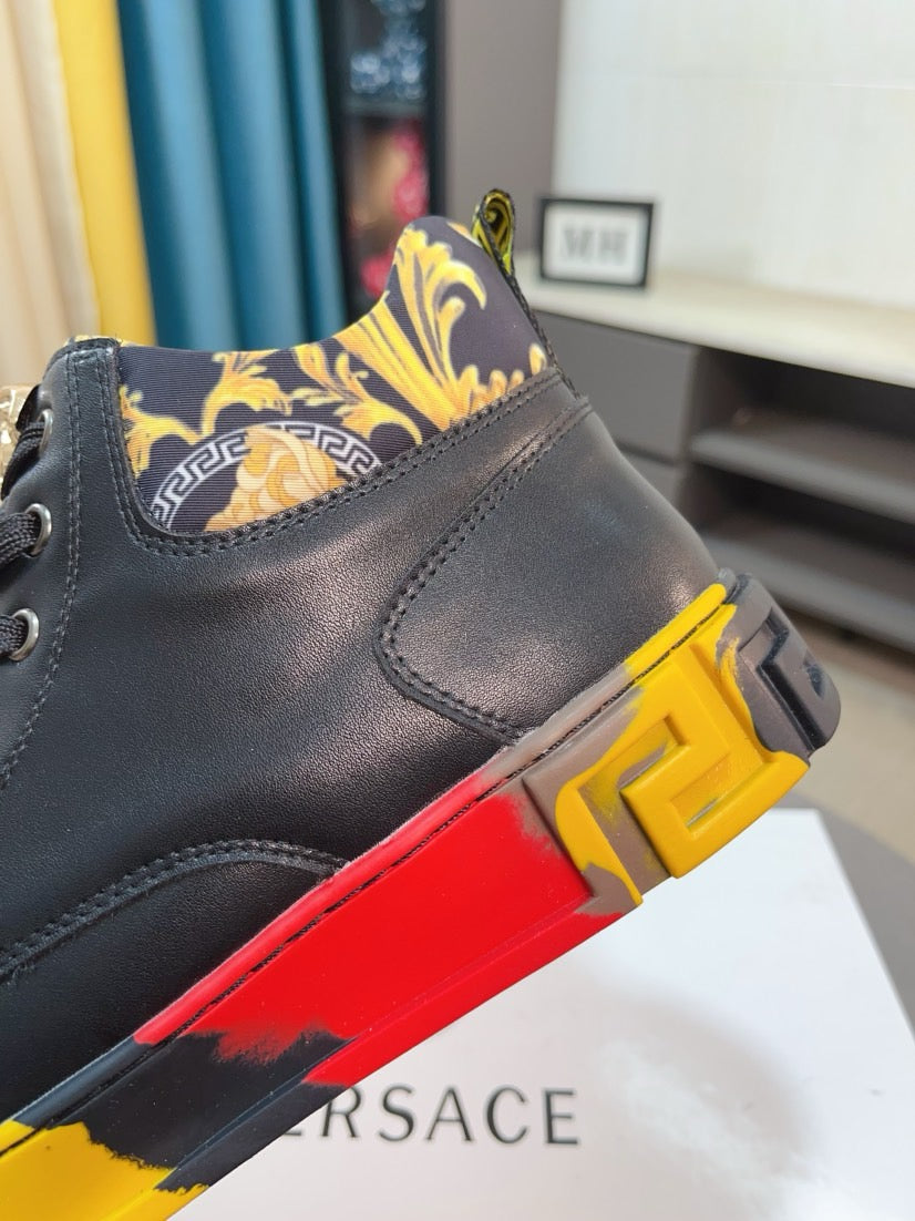 Close-up of black high-top sneaker collar with gold-and-yellow patterned lining and red/yellow sole