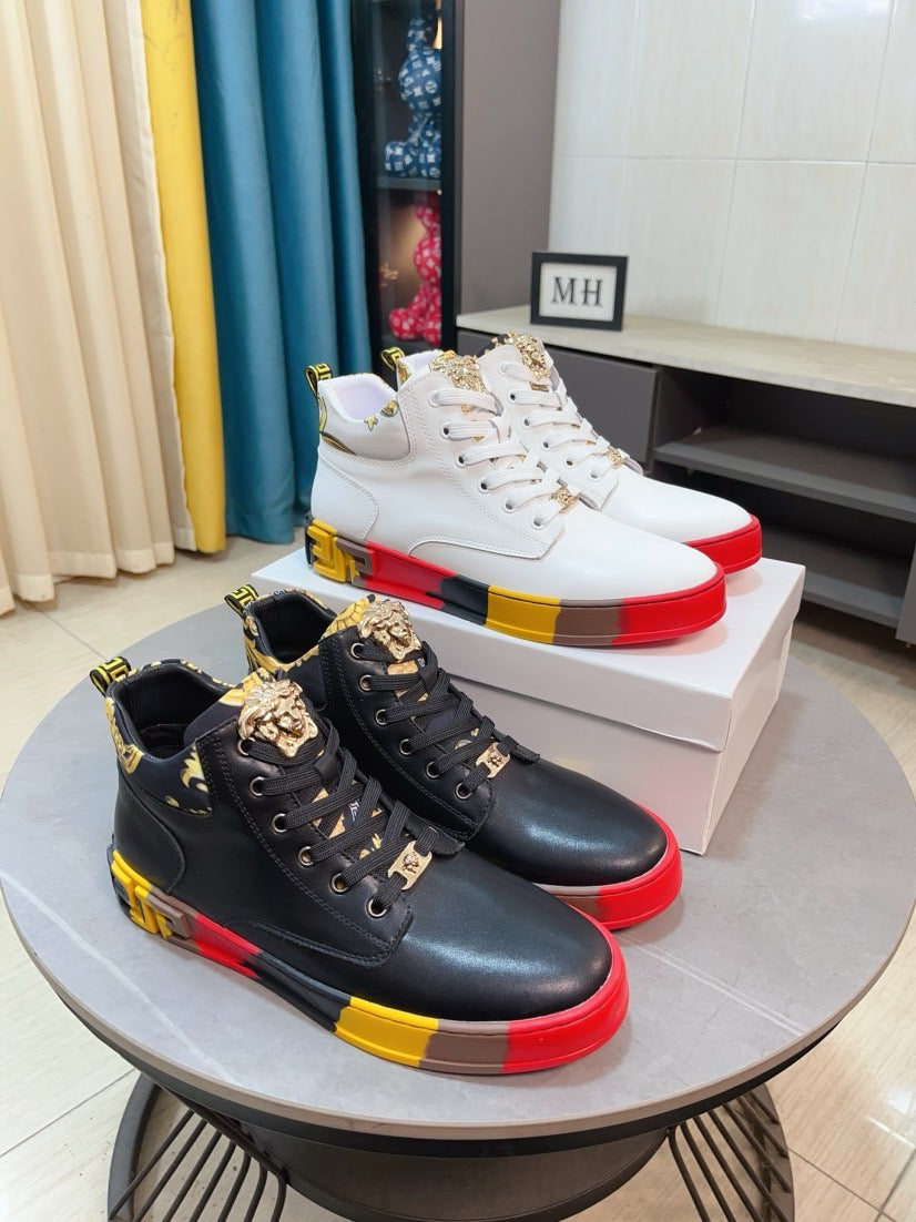 High-top sneakers with black upper and red/yellow edge outsole, lace-up with logo detail