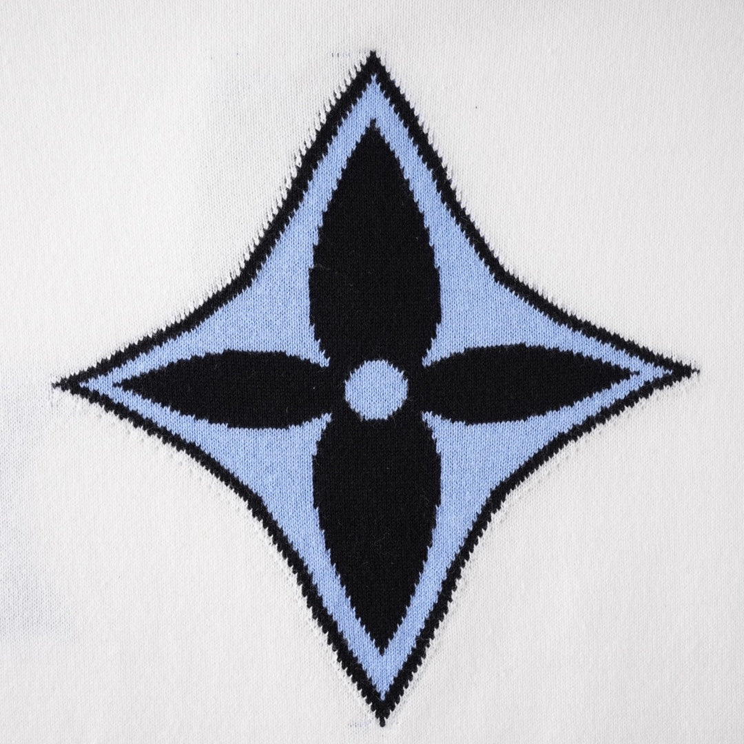White T-shirt close-up of large blue four-point star logo