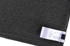 Dark gray T-shirt hem with blue fabric tag