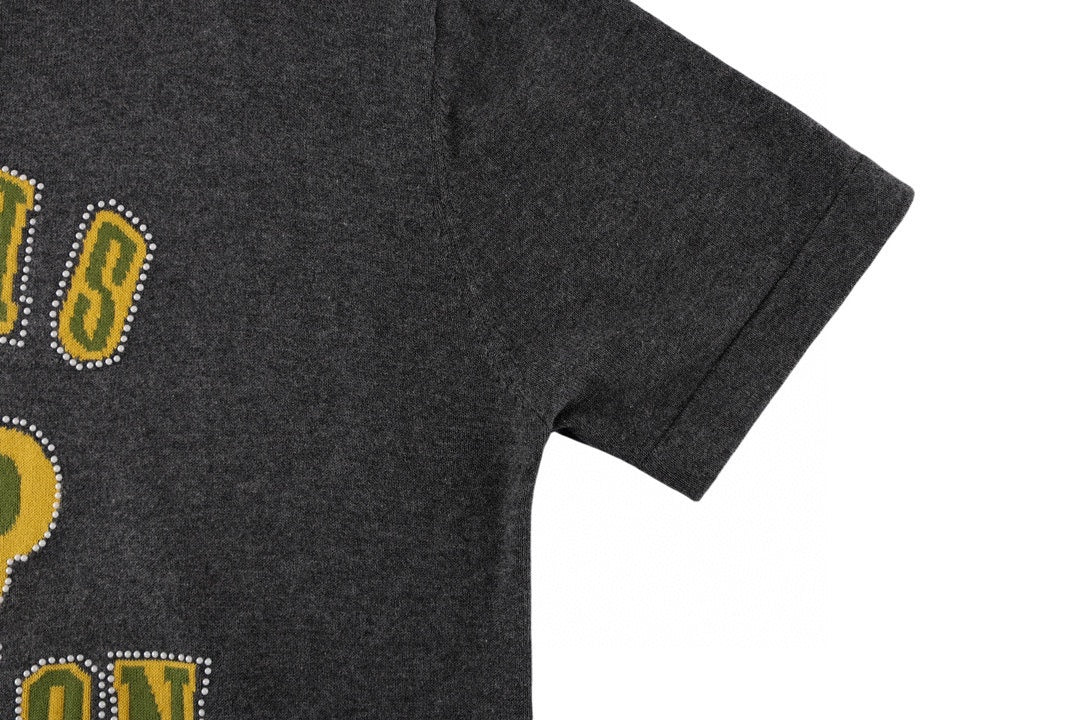 Dark gray T-shirt with partial rhinestone-style graphic on the side