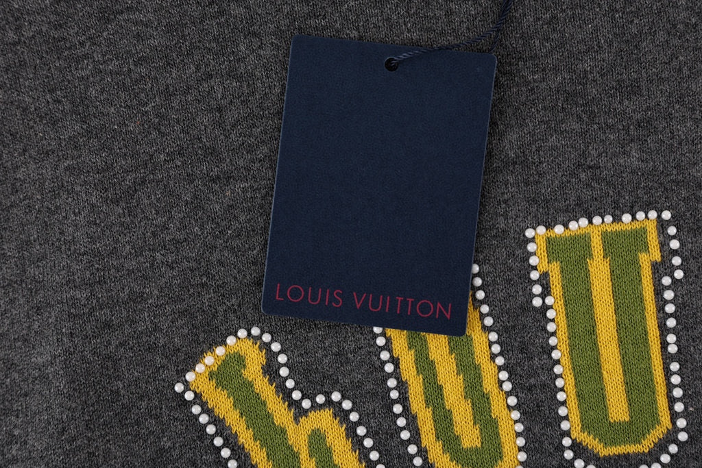 Dark gray T-shirt with rhinestone-style "LUIS VUITTON" and LV paw graphics