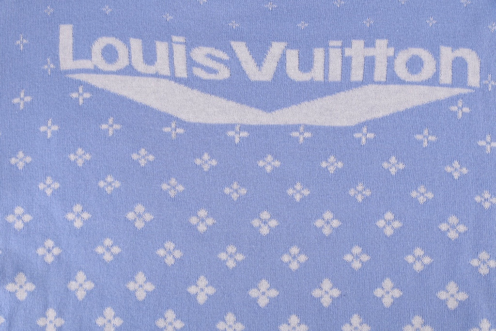 Light blue short-sleeve shirt with large back logo text and repeating white pattern