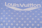 Light blue short-sleeve shirt with large back logo text and repeating white pattern