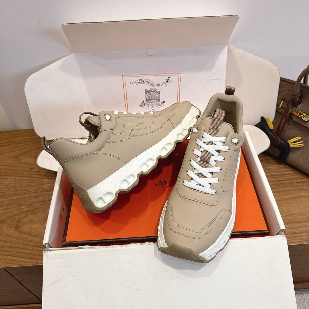 Beige lace-up sneakers with chunky white tread sole, side and front angle pair.