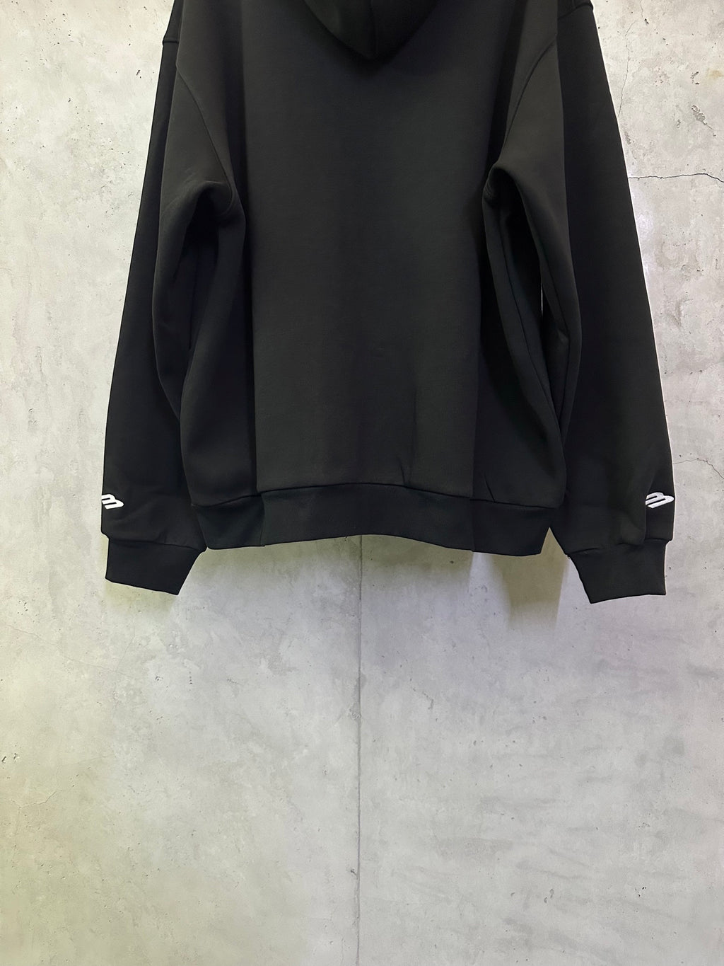 Balenciaga black zip-up hoodie sleeves and front hem with ribbed cuffs