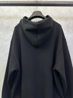 Balenciaga black zip-up hoodie back view with center hood seam