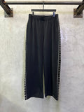 Balenciaga black pants with elastic waistband and side striped trim