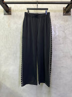 Balenciaga black pants with elastic waistband and side striped trim